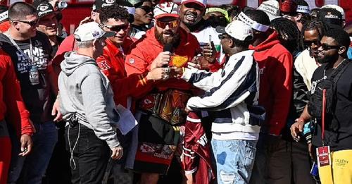 watch : Travis Kelce is too drunk to SPEAK and has to be held up by his teammates on stage at Kansas City Chiefs' Super Bowl parade