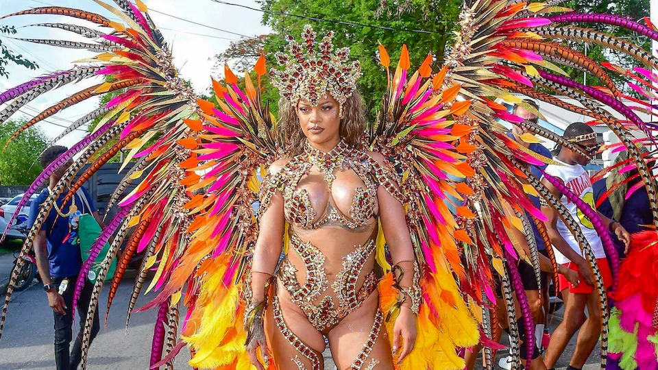 Rihanna dazzled in a custom bedazzled costume adorned with gold and bronze jewels that shimmered under the sun: Rihanna shines in Barbados with opulent Carnival look as she celebrates Crop Over Festival