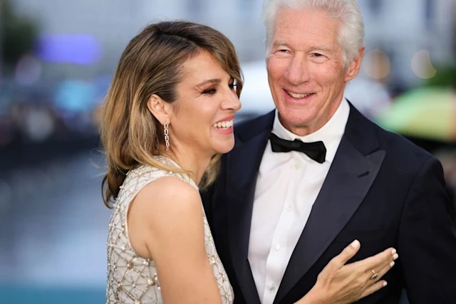 Richard Gere, 75, can't keep his hands off wife Alejandra, 41, as she wears bridal gown for red carpet