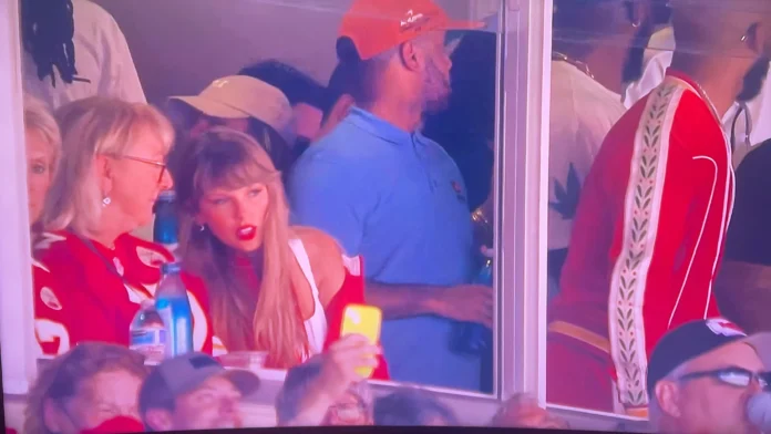 Taylor Swift sits next to Travis Kelce's mom Donna in her custom Chiefs puffer jacket as she watches her boyfriend in the NFL playoffs amid reports they had a blazing row over Christmas