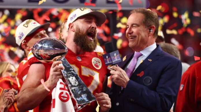 watch : Travis Kelce is too drunk to SPEAK and has to be held up by his teammates on stage at Kansas City Chiefs' Super Bowl parade