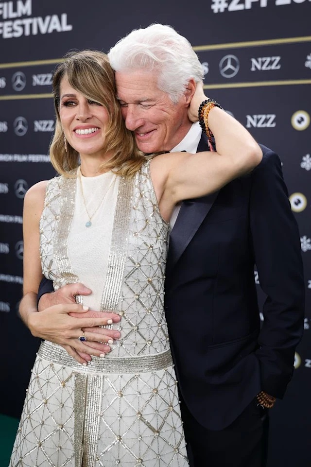 Richard Gere, 75, can't keep his hands off wife Alejandra, 41, as she wears bridal gown for red carpet