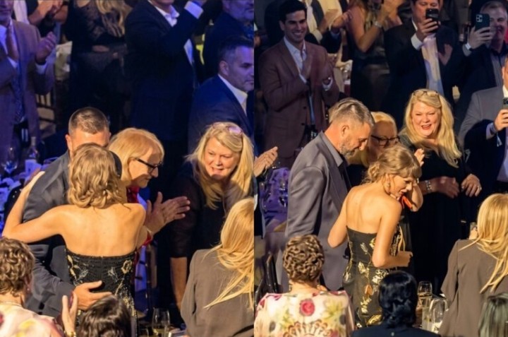 Crowd erupts with “get a room!” chants as Taylor Swift and Travis Kelce pack on the PDA, share a passionate kiss at the Songwriters Hall of Fame induction while Andrea Swift looks on proudly cheering them at star-studded gala