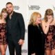 Taylor Swift Stuns in a Burgundy Velvet Mini Dress With Chiffon Print as She Steals the Spotlight With Husband Travis Kelce and Mom Andrea Swift on the Red Carpet at Her Nashville Songwriters Hall of Fame Induction